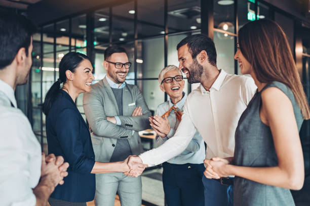 Group of business persons handshake in the office